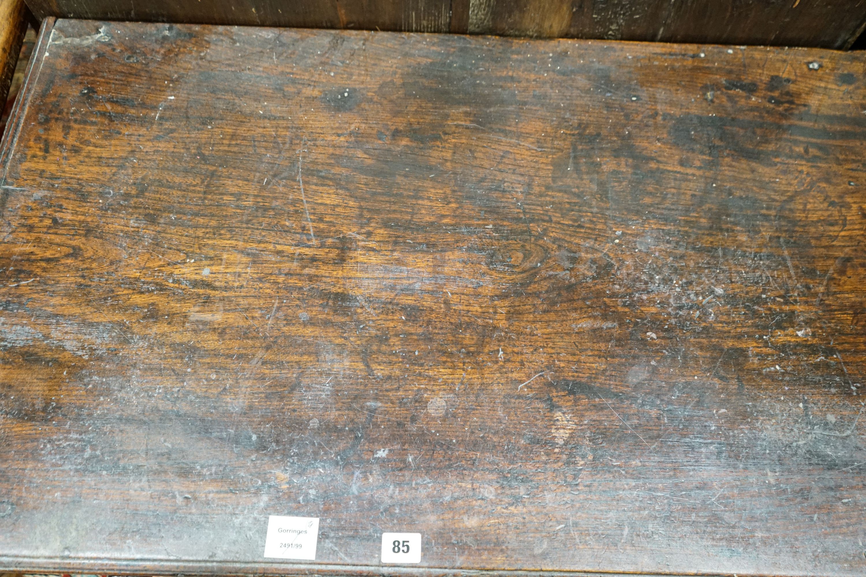 An early 19th century oak low boy, fitted three drawers, on square tapered legs, width 94cm, depth 55cm, height 77cm